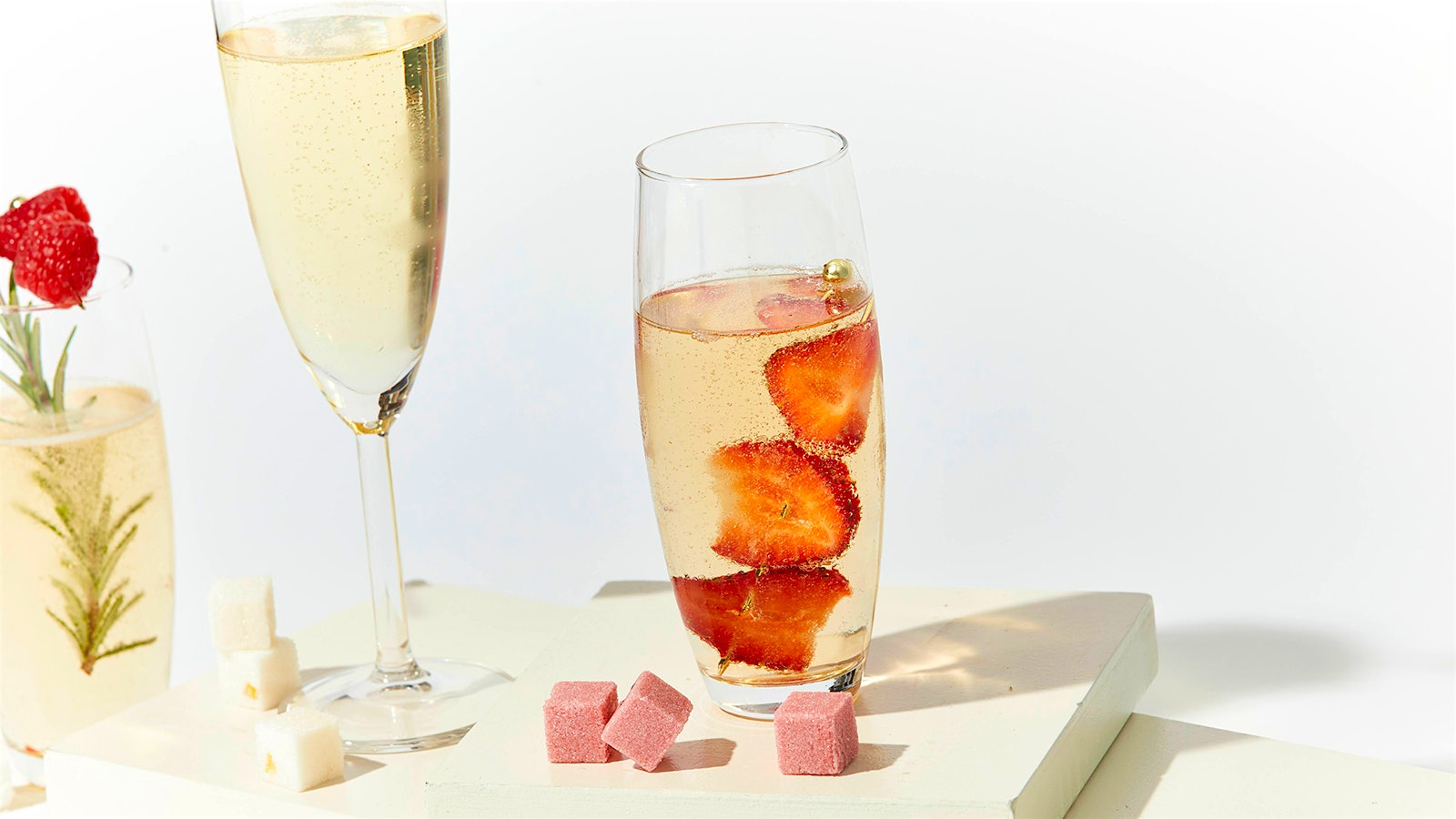 Teaspressa Luxe Mixology Cubes alongside Champagne flutes